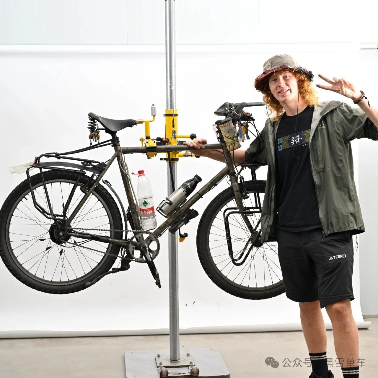 Fabian with his bicycle after repair
